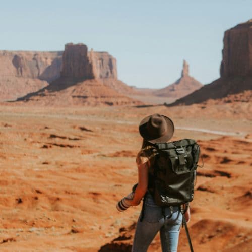 A photo of a photographer in a vast desert landscape